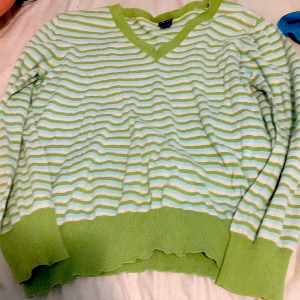 Green sweater with white and blue stripes